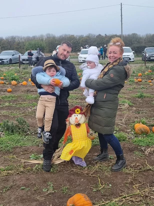 Paul holding Maverick and Gemma holding Denvah