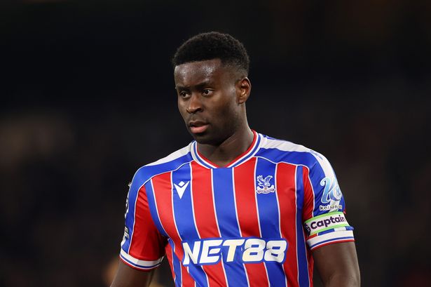 Marc Guehi looks on while playing for Crystal Palace