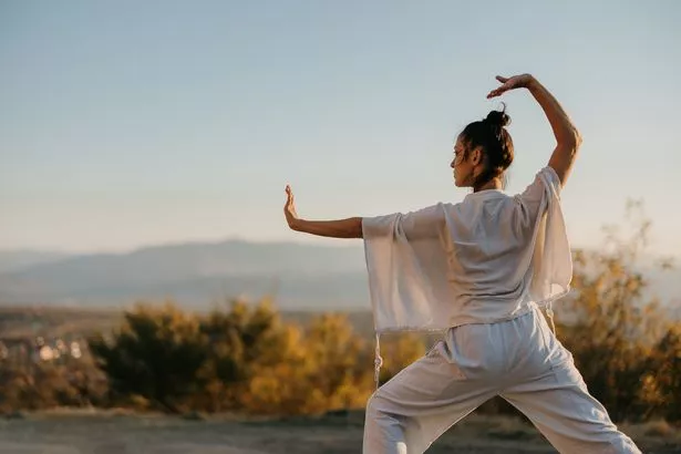 Woman practicing tai chi