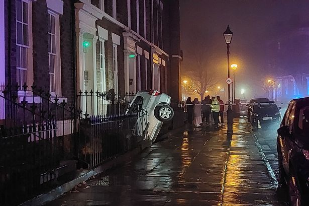 The car was wedged in a gap at the front of the house