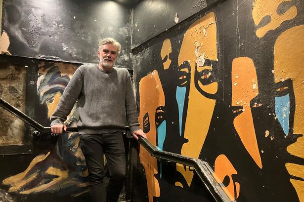 Graham Stanley, co-owner of the Jacaranda, with the famous mural (left) reportedly painted by Beatles John Lennon and Stuart Sutcliffe.
