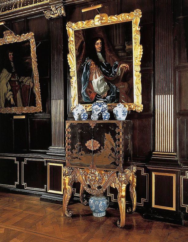 UNITED KINGDOM - CIRCA 2003:  Chinoiserie, lacquered cabinet, 1630-1650, Dutch support in gilt and carved wood, with a portrait of Charles II of England on the wall by the School of Peter Lely, Ham House, Richmond-upon-Thames, United Kingdom. (Photo by DeAgostini/Getty Images)