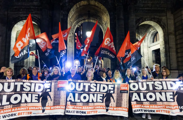 The women protesting outside the city chambers. 