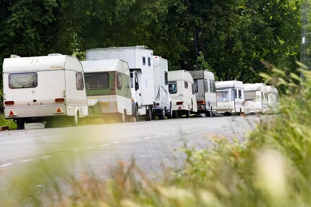 Caravans and vans parked on Parry Lane on the Downs