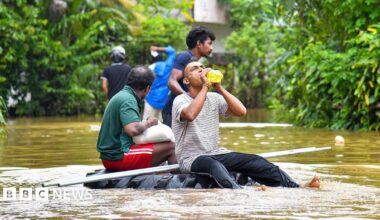 People navigate floodwaters on a makeshift raft as heavy rains from Cyclone ''Ditwah'' sweep through Colombo, Sri Lanka, on 29 November 2025.