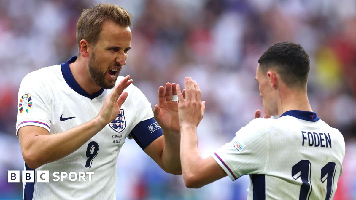 England captain Harry Kane (left) high fives team-mate Phil Foden