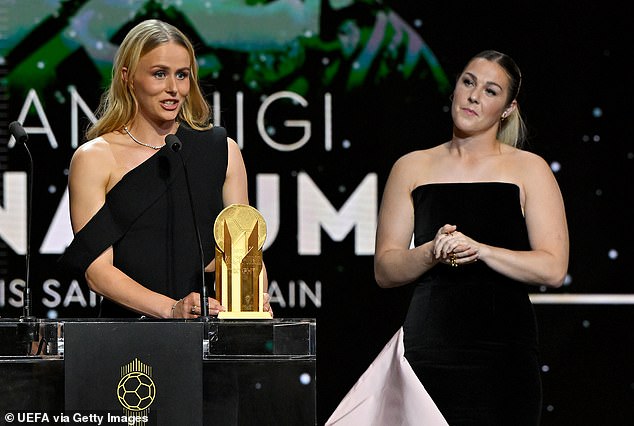 Mary Earps (right) has said that Hannah Hampton's 'bad behaviour' was rewarded in her new autobiography. Pictured watching her Lionesses rival winning the Women's Yashin Trophy
