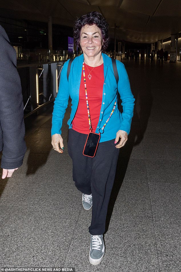 Ahead of her lengthy flight across the world, Ruby beamed as she headed to the terminal