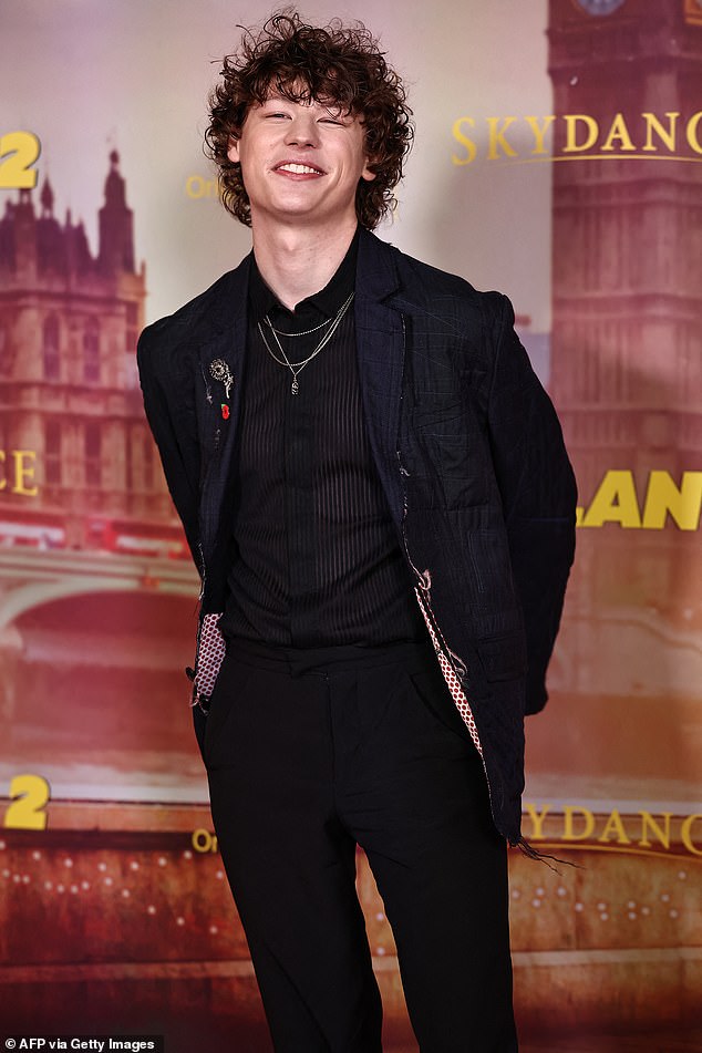 Van looked stylish in a black suit