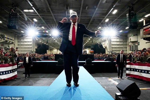Trump dances as he prepares to leave after speaking to troops aboard USS George Washington in Japan