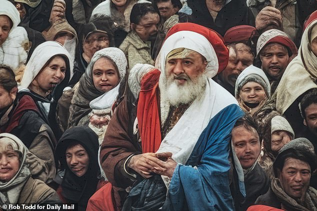 Some sections of the mural appear show crowds of people with grotesquely distorted faces