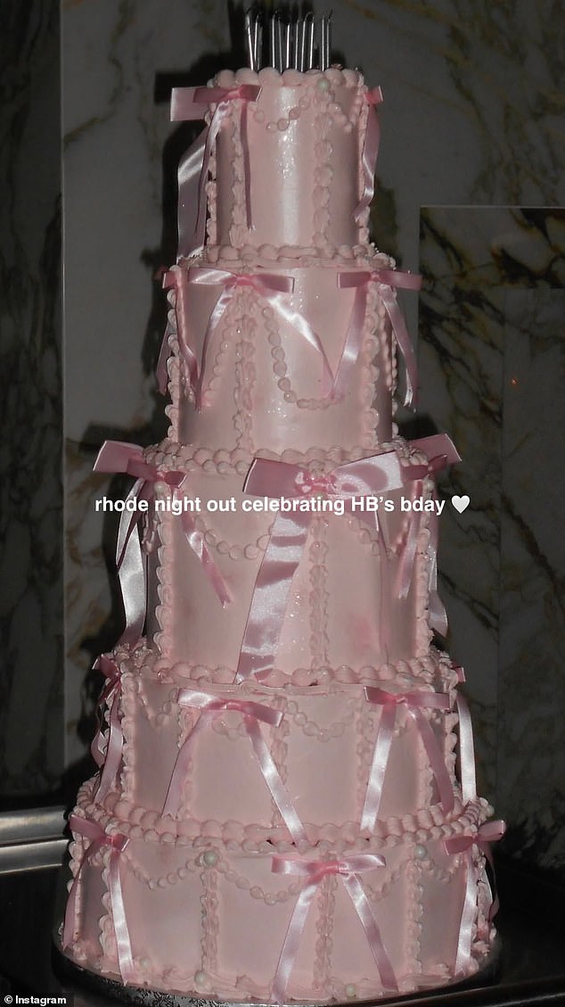 The dessert was layered with a thick sugary pink frosting while pastel pink ribbons were also placed on the edges