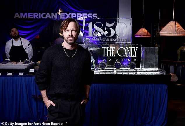 Aaron Paul, seen here at The Only at 1850 by American Express party in Las Vegas Thursday, exclusively told the Daily Mail why he and his family moved to Paris