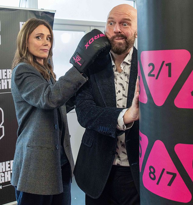 Actress Keeley Hawes with The Feathers Association's chief executive David Jones