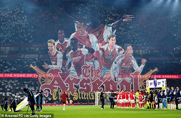 Supporters unfurled a vast banner featuring a montage of club icons from past and present - and at the very top sat Sol Campbell, who infamously moved from Spurs to the Gunners