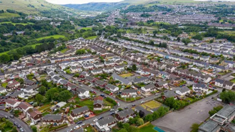 Getty Images Aerial drone view of houses and green hills in Ebbw Vale in south Wales