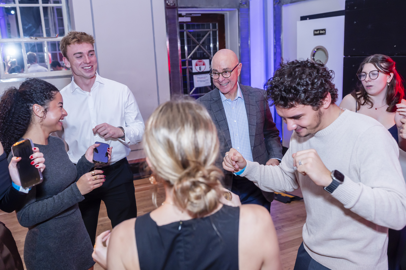 People dancing, including Northeastern University president Joseph Aoun