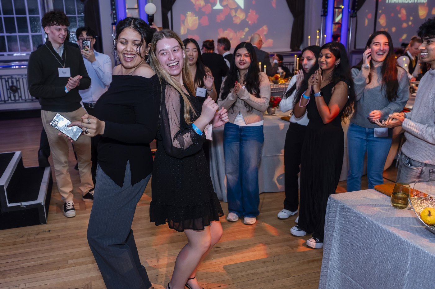 People dancing around banqueting tables
