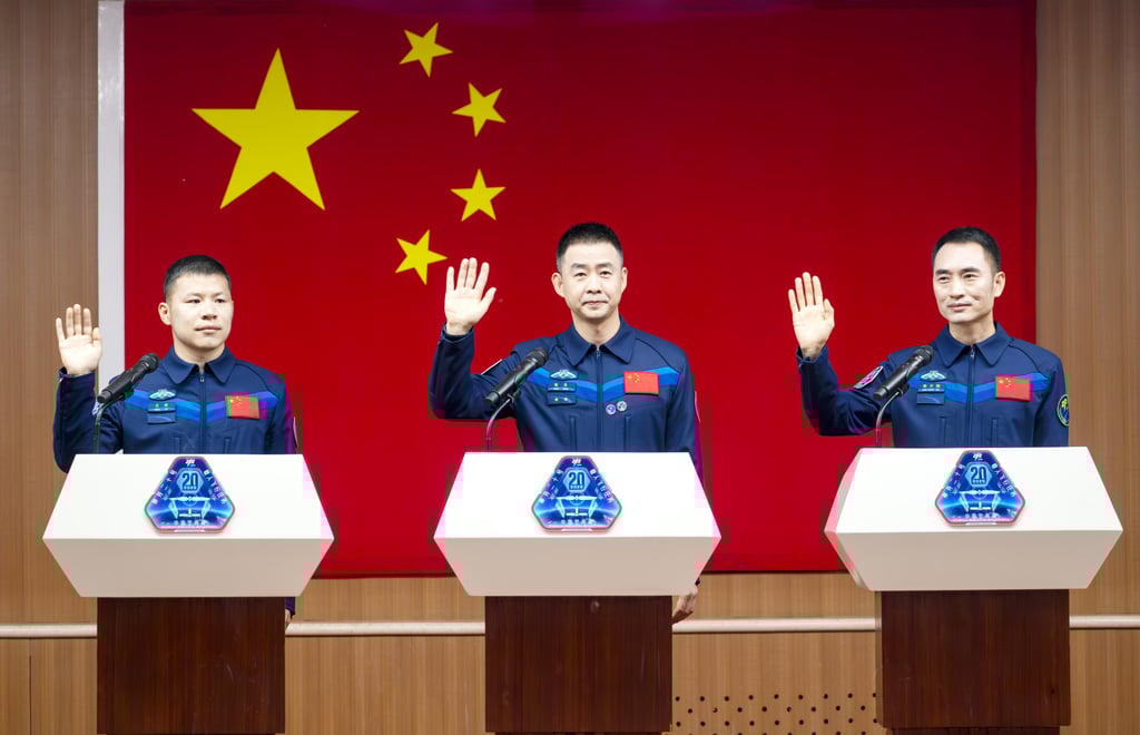 From left, Chinese astronauts Wang Jie, Chen Dong and Chen Zhongrui pictured in April ahead of the Shenzhou-20 mission. Photo: Getty Images