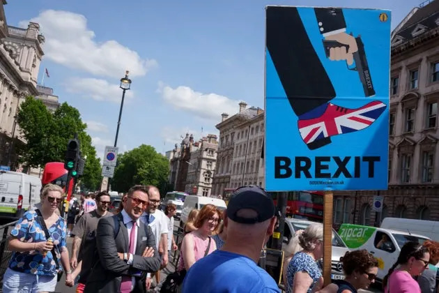 Pro-Europe campaigners and tourists during the regular anti-Brexit 'rejoin the EU' protest at the junction of Parliament Street and Parliament Square in Westminster, on 18th June 2025, in Westminster, London, England.