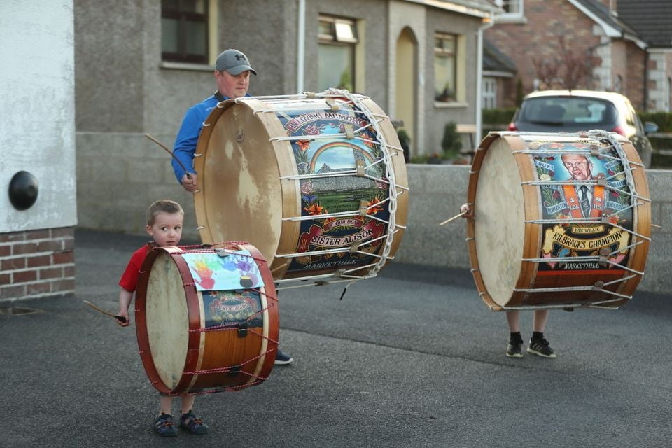 Mark Black and his sons, Thomas (left), four, and Adam, 10, from Markethill played Lambeg drums outside their home during the Clap for Carers applause amid the pandemic (Photo by Niall Carson/PA Images via Getty Images)