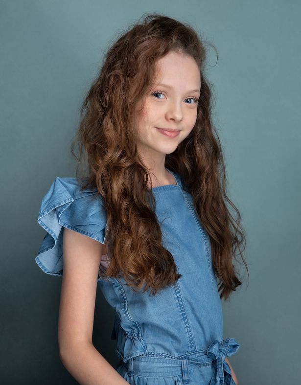 Iona Bell pictured standing 