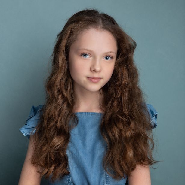 Iona Bell, pictured looking into the camera, smiling