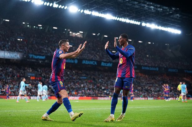 Robert Lewandowski of FC Barcelona celebrates scoring his team's second goal with teammate Marcus Rashford during the LaLiga EA Sports match between RC Celta de Vigo and FC Barcelona at Estadio Abanca-Balaidos on November 09, 2025 in Vigo, Spain