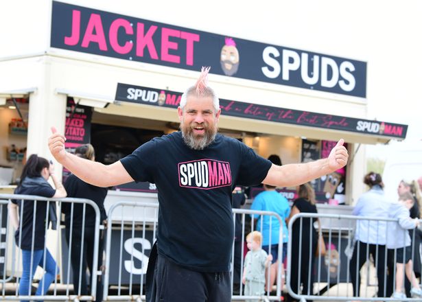 Spudman, also known as Ben Newman, outside his van on Crosby Beach