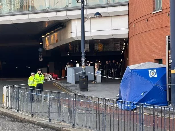 Police officers at the scene of where a woman was fatally stabbed in Birmingham city centre