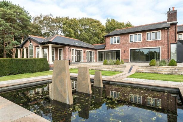 A water feature and the exterior of Mark Hughes' lavish Cheshire mansion