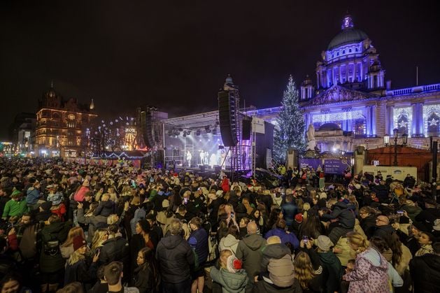 Belfast lights up for Christmas as crowds pack into City Hall for performances and festive market