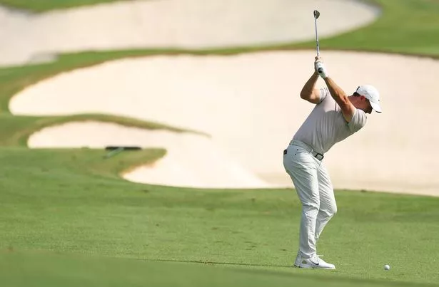 Rory McIlroy strikes a ball