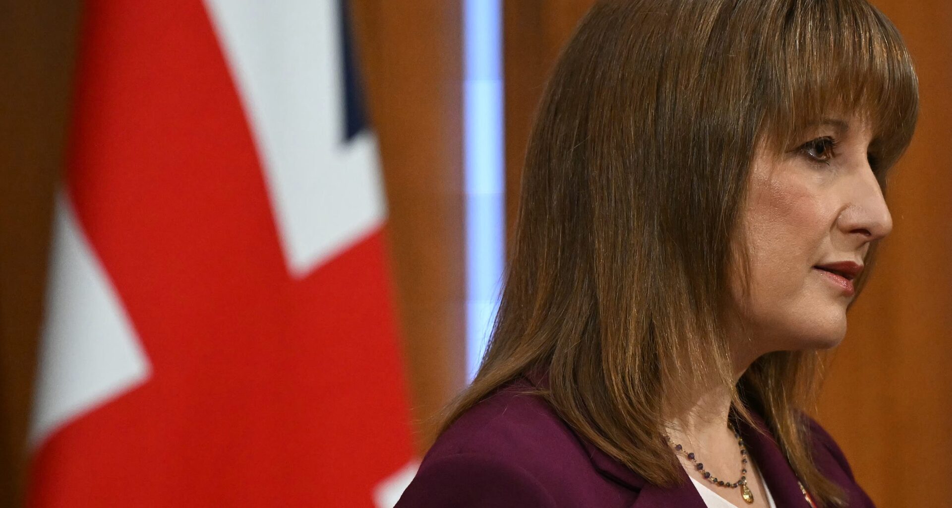 Breaking news scene with reporters and cameras at a press conference, capturing a significant business announcement event