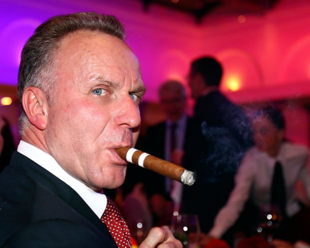 Karl-Heinz Rummenigge smokes a cigar
