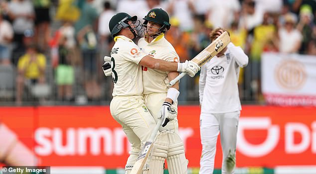 PERTH, AUSTRALIA - NOVEMBER 22: Marnus Labuschagne of Australia celebrates winning the first test with team mate Steve Smith of Australia during day two of the First 2025/26 Ashes Series Test Match between Australia and England at Perth Stadium on November 22, 2025 in Perth, Australia. (Photo by Cameron Spencer/Getty Images)