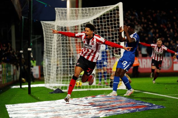 Jonathan Tomkinson of Cheltenham Town celebrates scoring a goal to make it 1-0