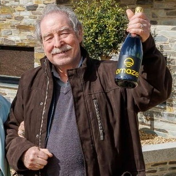 Anthony Doyle celebrating his wife's Omaze lottery victory in 2024