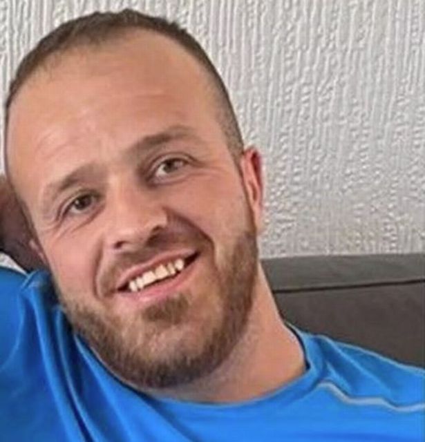 A picture of Craig Richardson who had tanned white skin and brown fair hair and is smiling in this picture at home