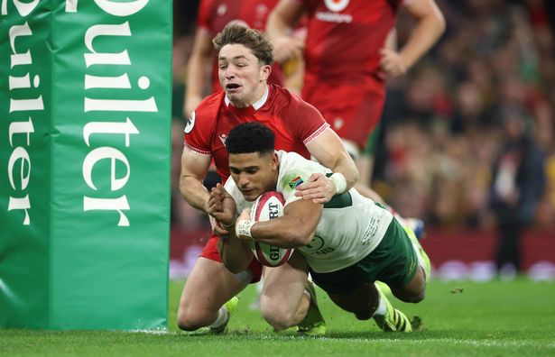 Sacha Feinberg-Mngomezulu of South Africa dives over for their sixth try