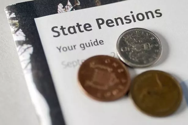 DWP handing state pensioners born before 1953 weekly payment increase
