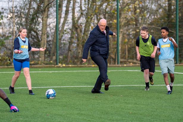 First Minister of Scotland John Swinney during a visit to a community football facility in Castlemilk, Glasgow,PA Photo. Photo credit should read: Jane Barlow/PA Wire