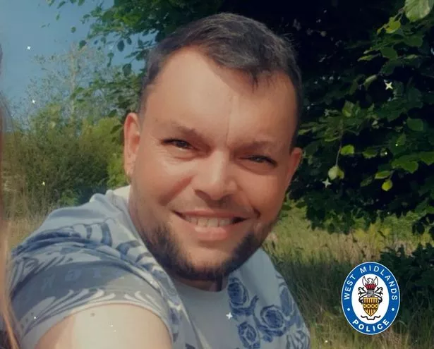 A supplied photo of Anthony Sharma, 43, with a beard and short hair, wearing a t-shirt in a rural setting issued by West Midlands Police