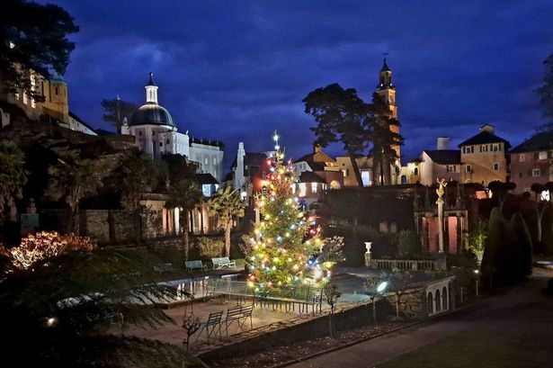 Tall Christmas tree in village plaza