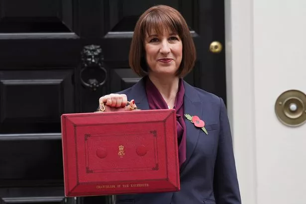 Chancellor of the Exchequer Rachel Reeves poses outside 11 Downing Street, London, with her ministerial red box.