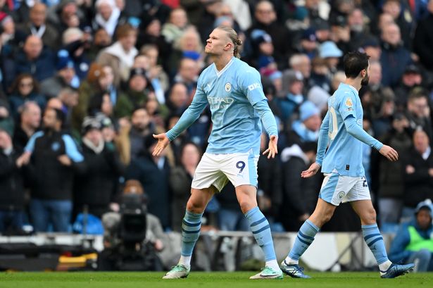 Erling Haaland of Manchester City celebrates after scoring the team's first goal during the Premier League match between Manchester City and Liverpool FC at Etihad Stadium on November 25, 2023 in Manchester, England. 