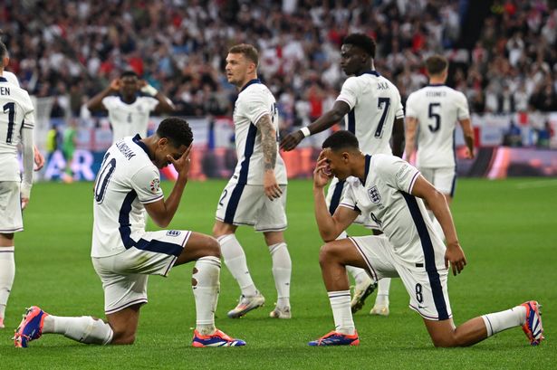 England's midfielder #10 Jude Bellingham celebrates with England's defender #08 Trent Alexander-Arnold after scoring his team's first goal during the UEFA Euro 2024 Group C football match between Serbia and England
