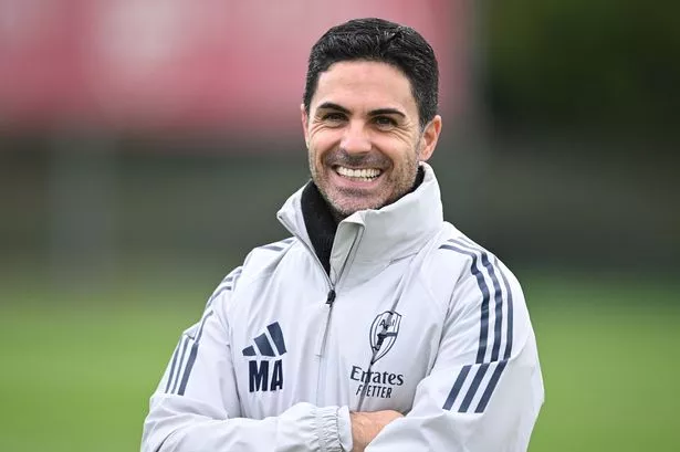 Mikel Arteta smiles in training.