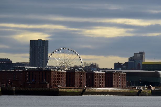The Liverpool Wheel near to the Royal Albert Dock and Arena can be seen from the River Mersey