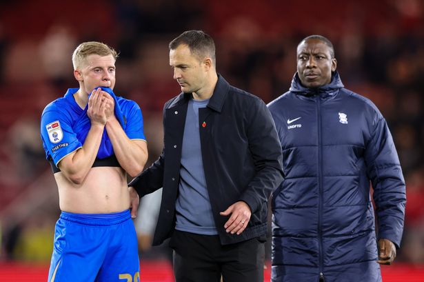 Birmingham City manager Chris Davies consoles Alex Cochrane after the 2-1 defeat at Middlesbrough